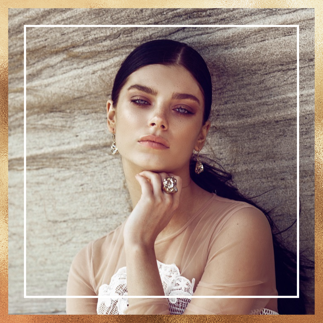 Female Model Wearing an Alchemia Ring and Earrings from Charles Albert Jewelry