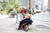 Trendy young girl hugging stylish working mom in New York City 