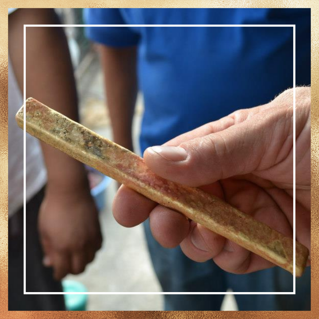 Person holding a solid piece of alchemia