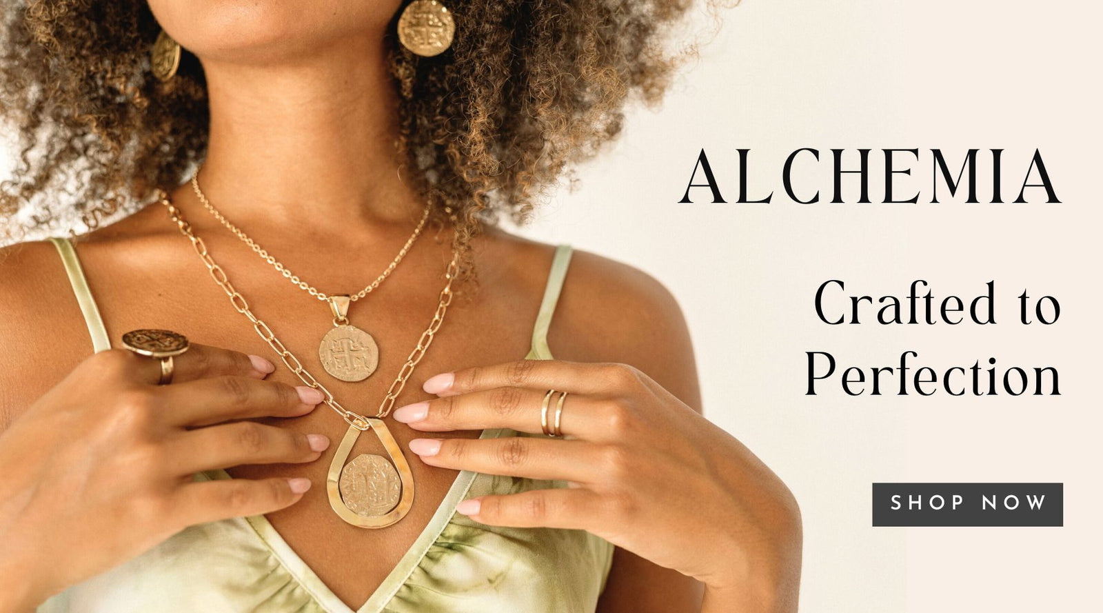 Model wearing Alchemia Coin Collection by Charles Albert: Crafted to Perfection