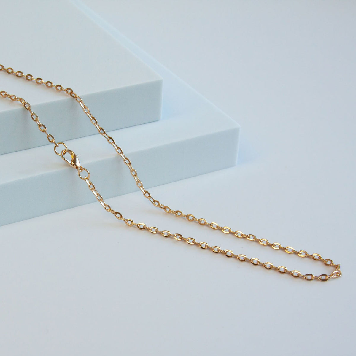 New Gold Tone Base Metal Flat Oval Chain | Charles Albert Jewelry