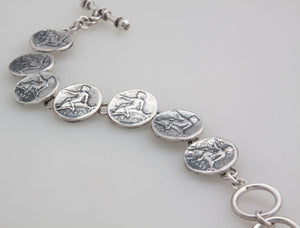 Sterling Silver Replica Boy on Dolphin Coin Bracelet | Charles Albert Jewelry